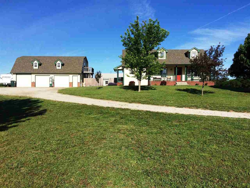 3 bedroom, 3 bath, 3+ garage on 19.34 acres.  There is an additional full studio apartment above garage.