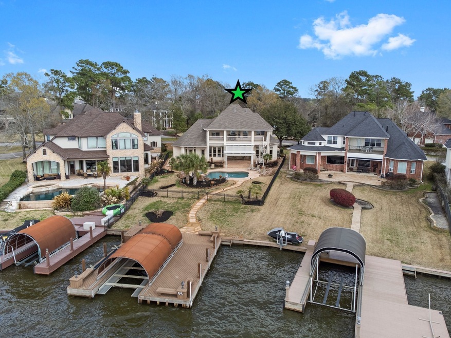 This fabulous estate is located in the gated community of Longmire on Lake Conroe. Boasting almost 1/3 of an acre, this property features a lovely pool/spa and a covered boat slip and dock with tie up areas on both sides which can accommodate both pontoon or V-hull.