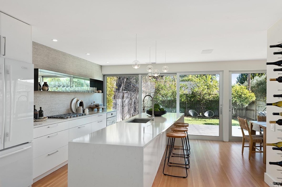 A glass wall of large Bonelli sliding doors connec