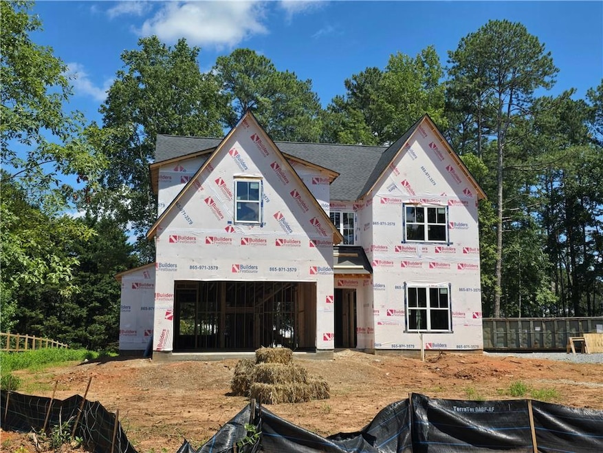 Property under construction featuring roof with shingles