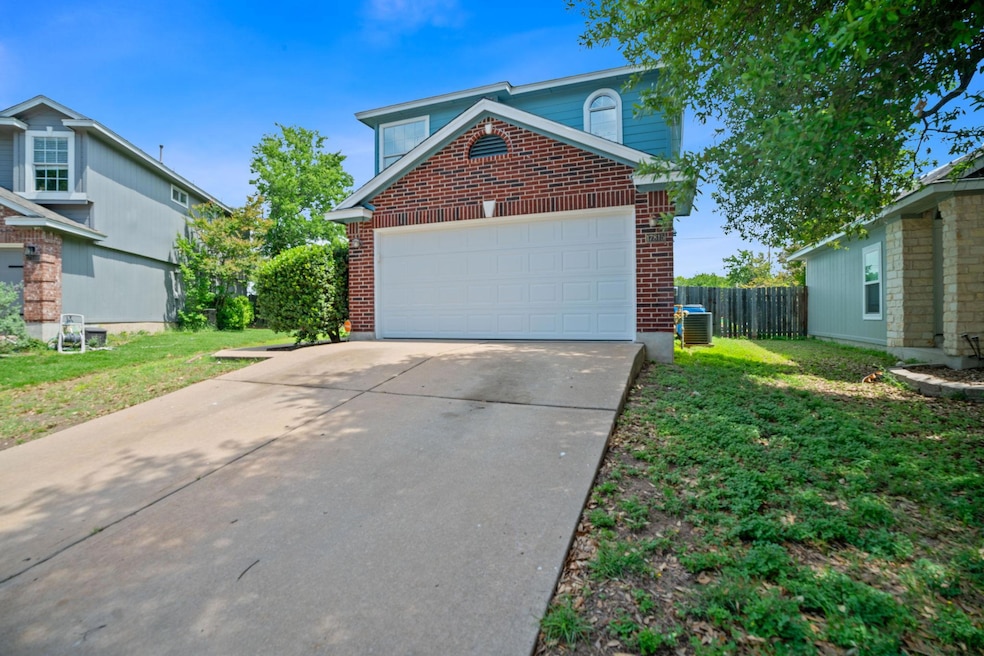 Traditional home with brick siding, concrete driv