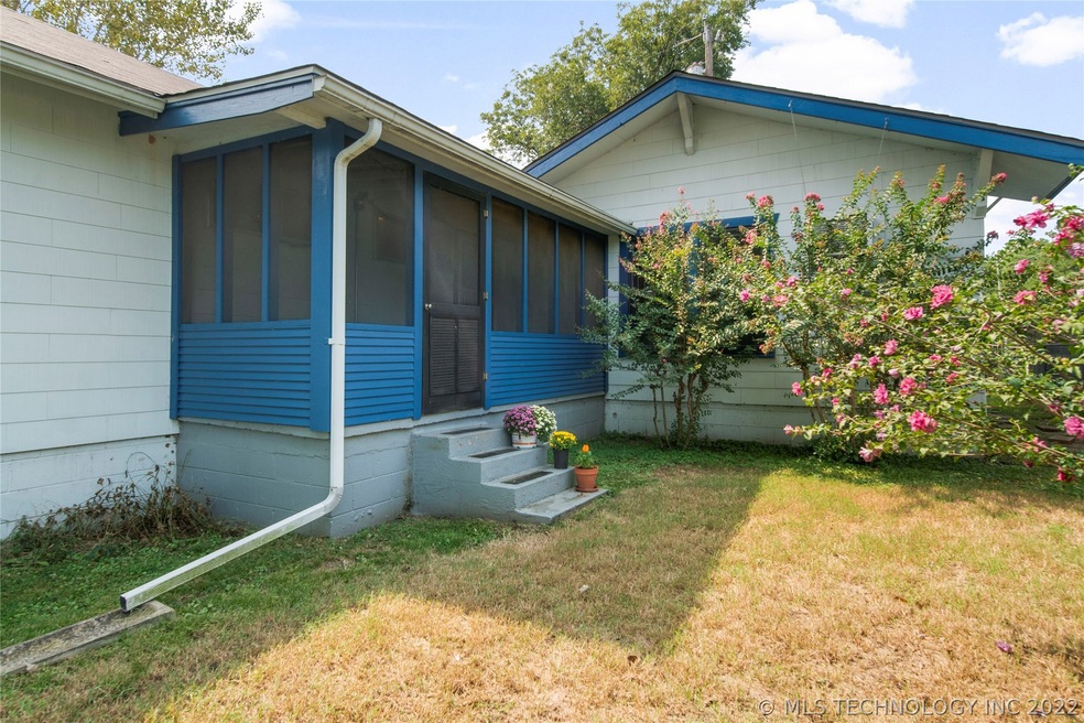 Charming front entry leads right to screened-in po