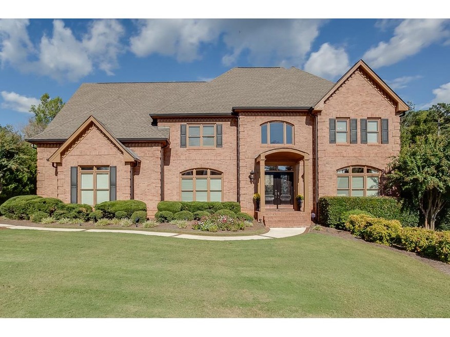 Beckoning brick home sits on spacious lot with pro