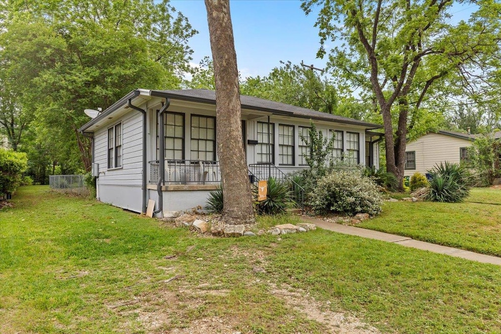 Single story home with a front lawn