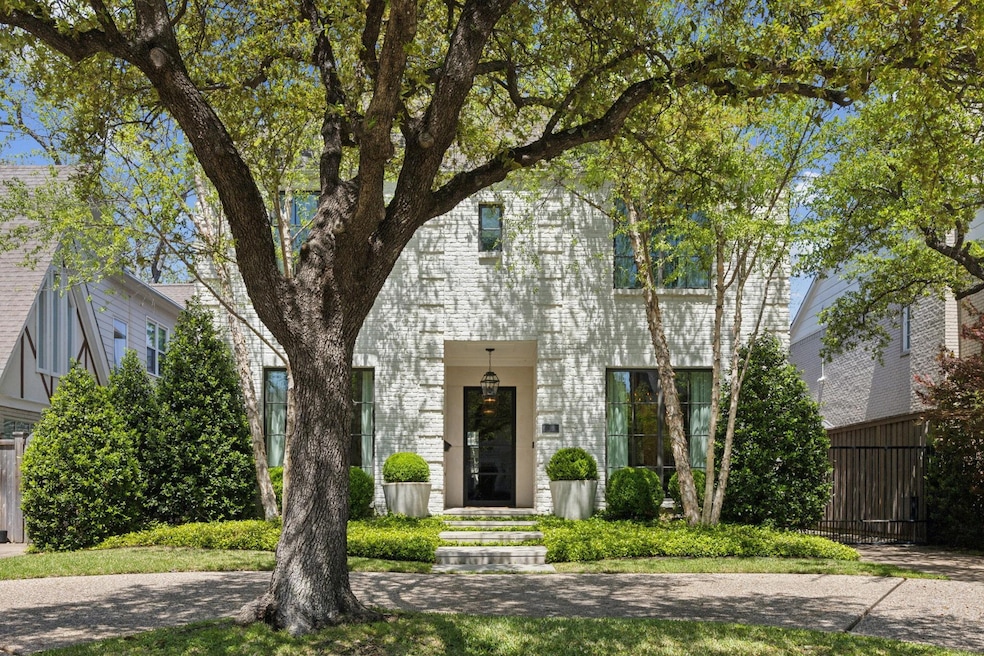 View of front of home featuring fence