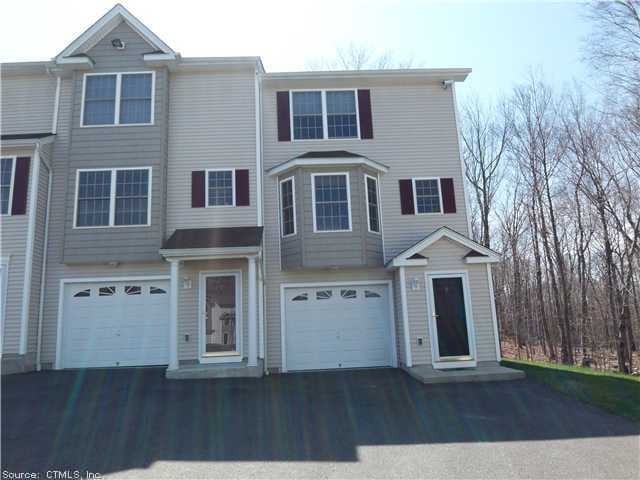 Exterior Front. Bright end unit...