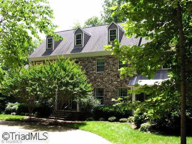 Exterior Front. Handsome stone & frame estate home resides on 123 magnificent acres of pasture land and virgin forest.