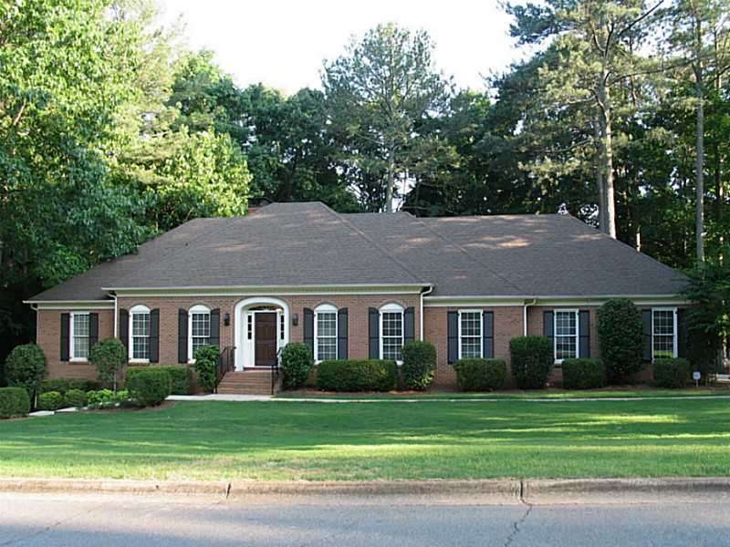 Exterior Front. Stately, classic 4-sides brick mas