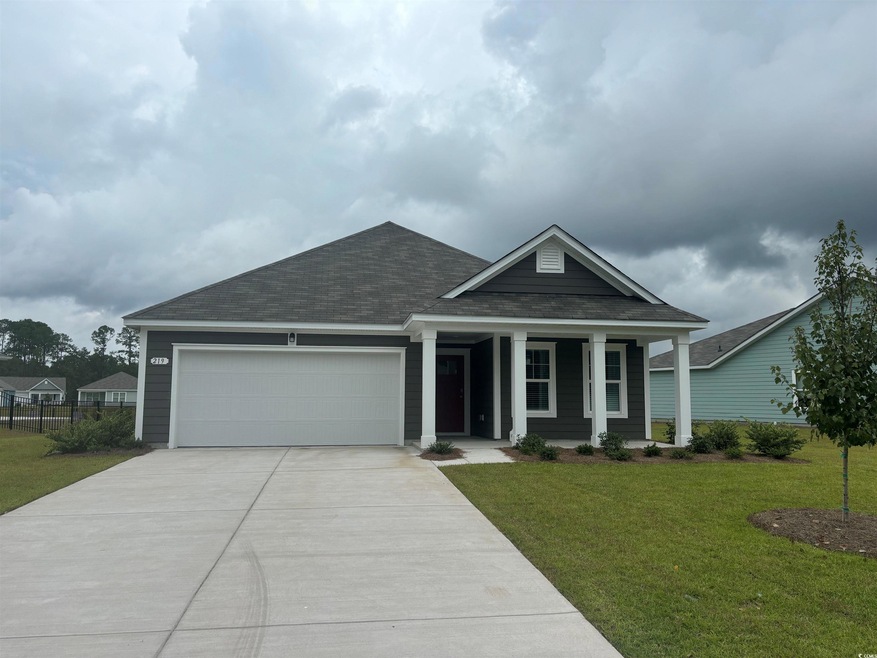 View of front of home featuring a garage, a front 
