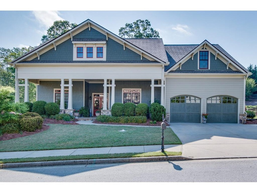 Craftsman-style 1 1/2 story ranch with flagstone f