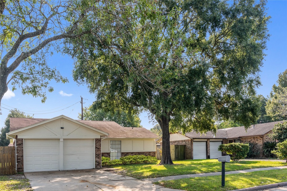This charming home features a two-car garage and a