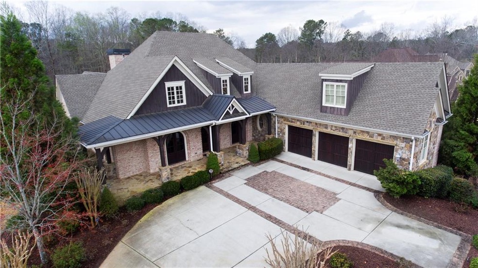 Stunning brick and stone craftsman home with 3 car