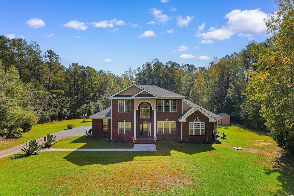 View of front of property featuring a front yard