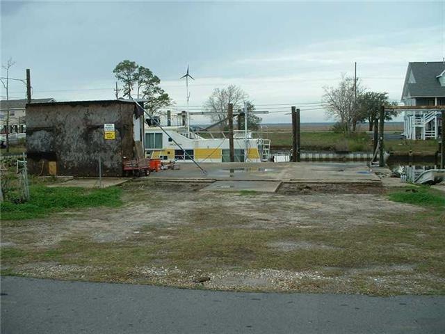 Photo. Nice lot 75 x 65 with boat back down ramp o