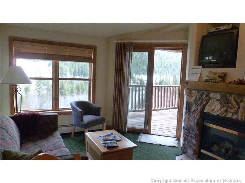 Living Room. Enjoy views of the river and ski slop