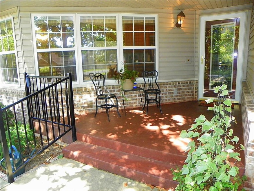 Morning coffee and Adult beverages in the evening aren't just reserved for the back deck~ Cov'd. front porch...Like another room, rain or shine!