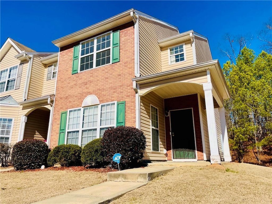 View of front of house featuring brick siding