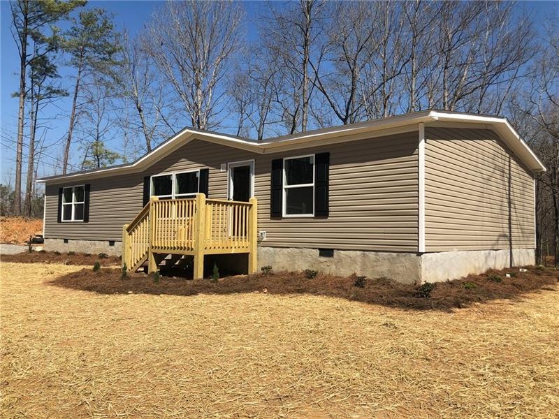 New mobile home, landscaped and ready for your fam