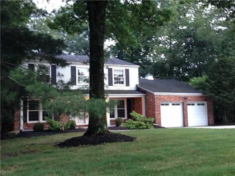 Exterior Front. Level Driveway, Attached Garage