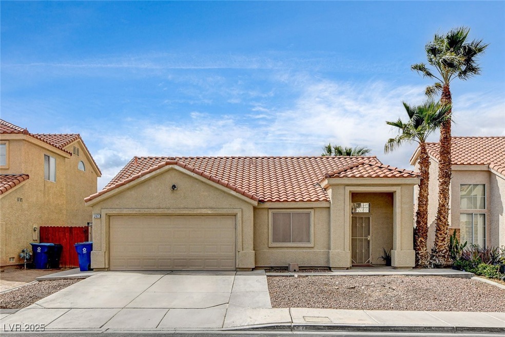Mediterranean / spanish house with a garage, drive
