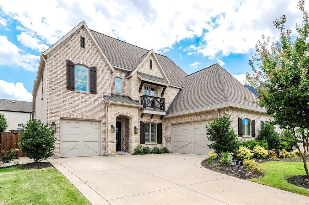 French provincial home with a garage