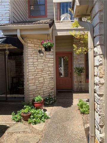 Gorgeous courtyard entry into this sweet home.