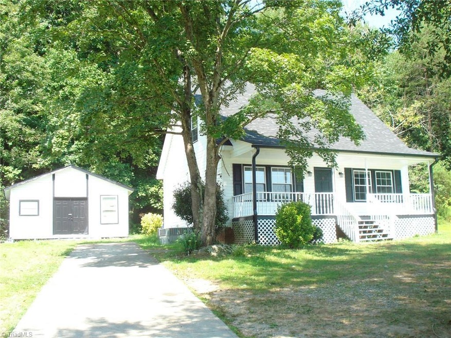 Exterior front of home and shed