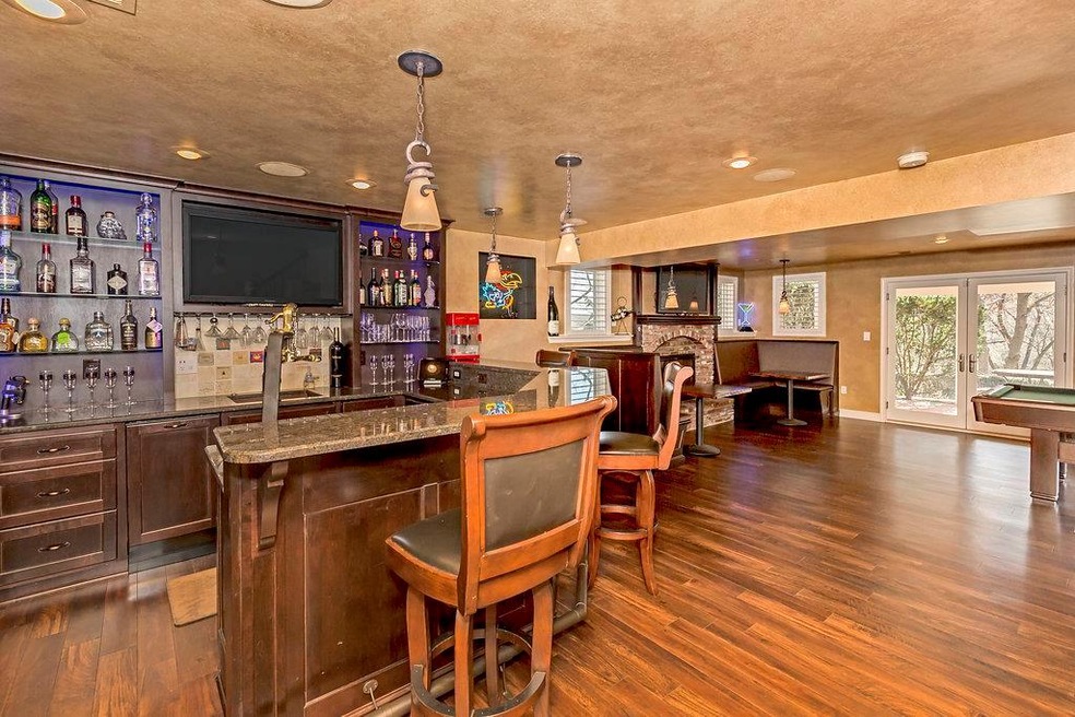 Bar with beverage fridge, oven, twin wine coolers 