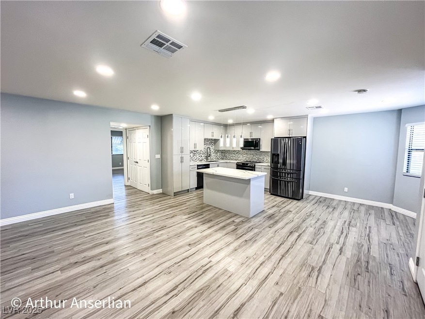 Kitchen with light countertops, backsplash, a kitc