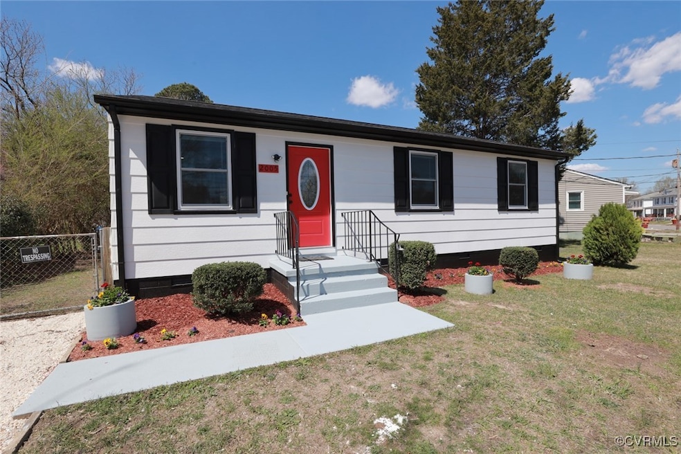 View of front of home with crawl space, fence, and