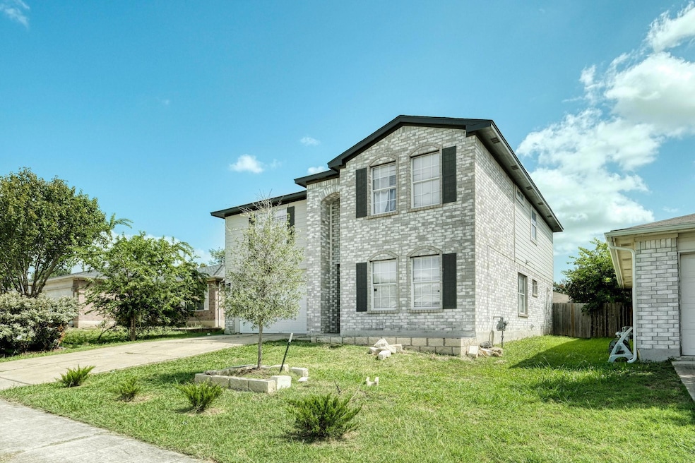 View of front of house with brick siding, concret