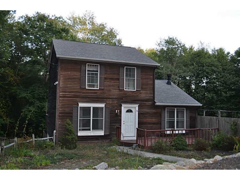 Exterior Front. Driveway leads to the integral gar