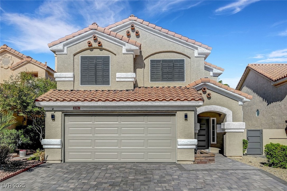 Mediterranean / spanish-style house featuring a ti