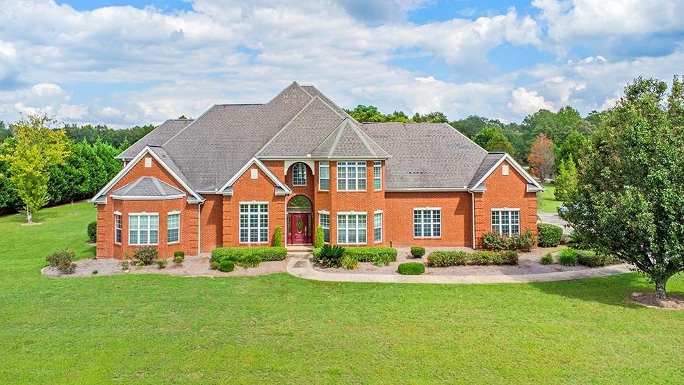 View of front of property with a front lawn
