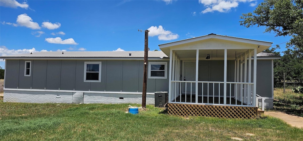 Back of house featuring board and batten siding, 