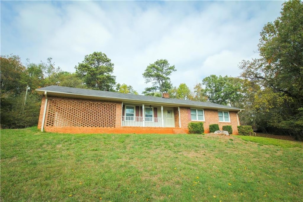 Ranch-style house with a front lawn