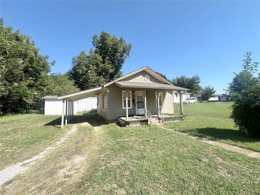 View of front of house with covered porch and a fr