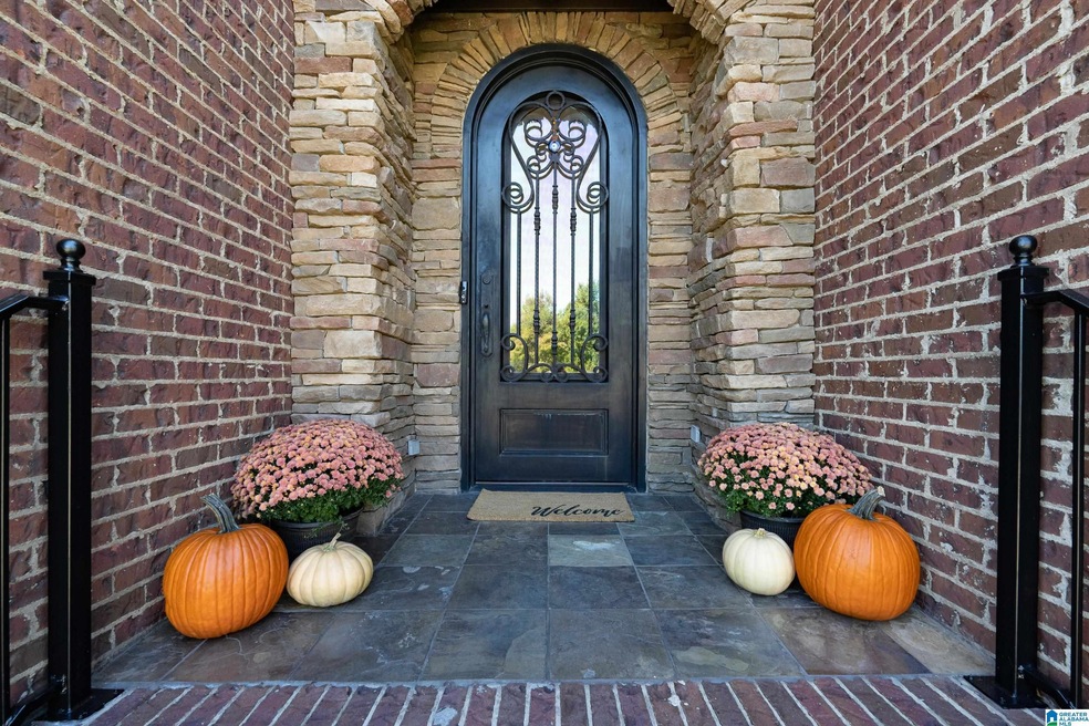 Showing stone accents on front porch and castle door. Proudly welcome guests here!