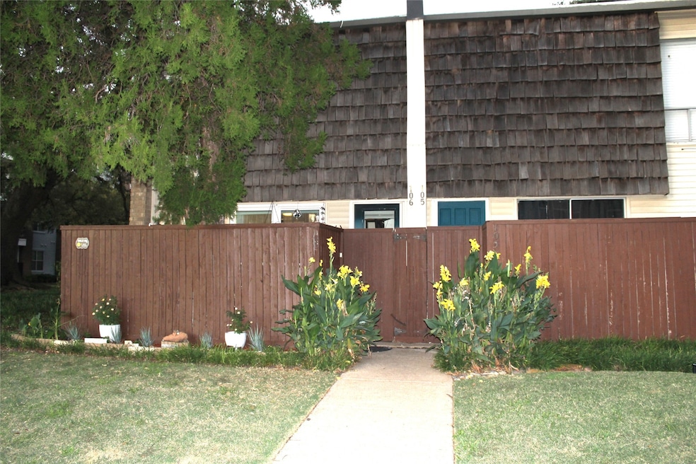 View of property exterior featuring mansard roof