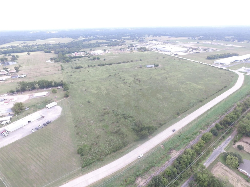 Birds eye view of property featuring a rural view