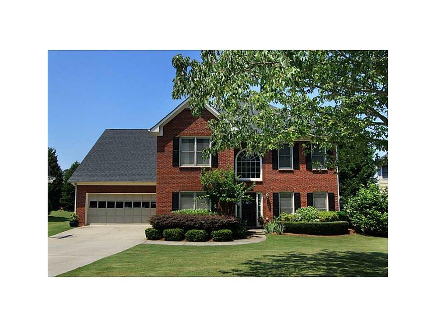 Exterior Front. Brick and hardiplank home on level