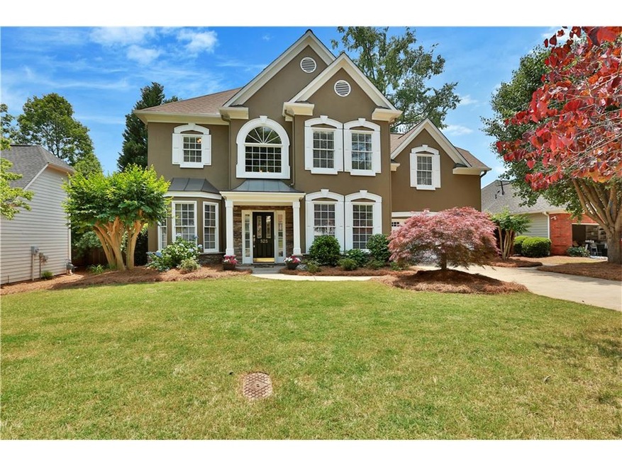 THIS is curb appeal! Beautifully landscaped and ma