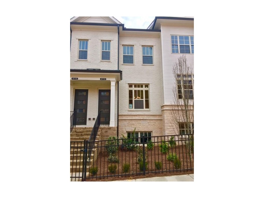 Painted Brick and Stone Exterior with landscaped e
