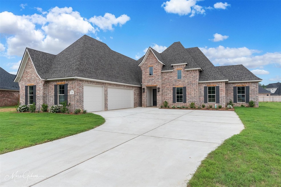 View of front of home featuring a garage and a fro