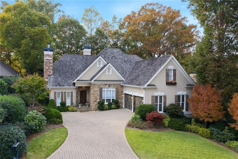 Beautifully situated with paver driveway, cedar sh