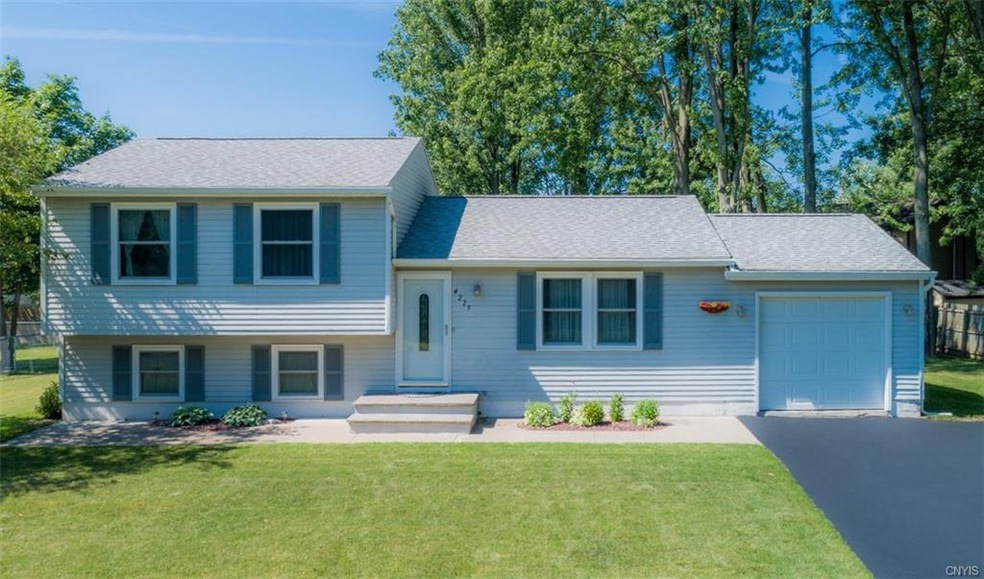 This Liverpool split level home just steps away fr