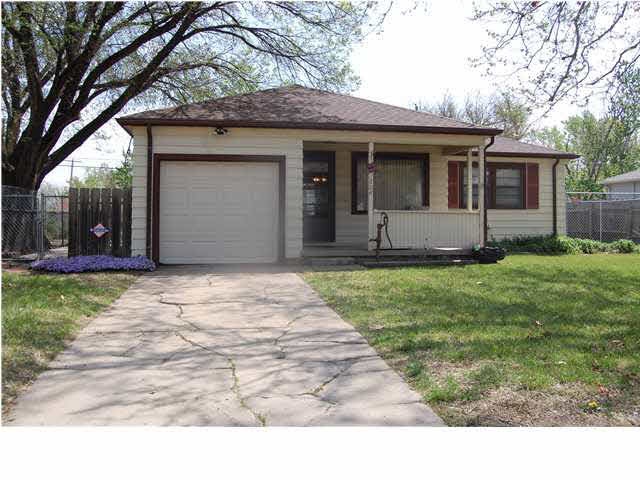 Front of home with Large covered front porch. You 