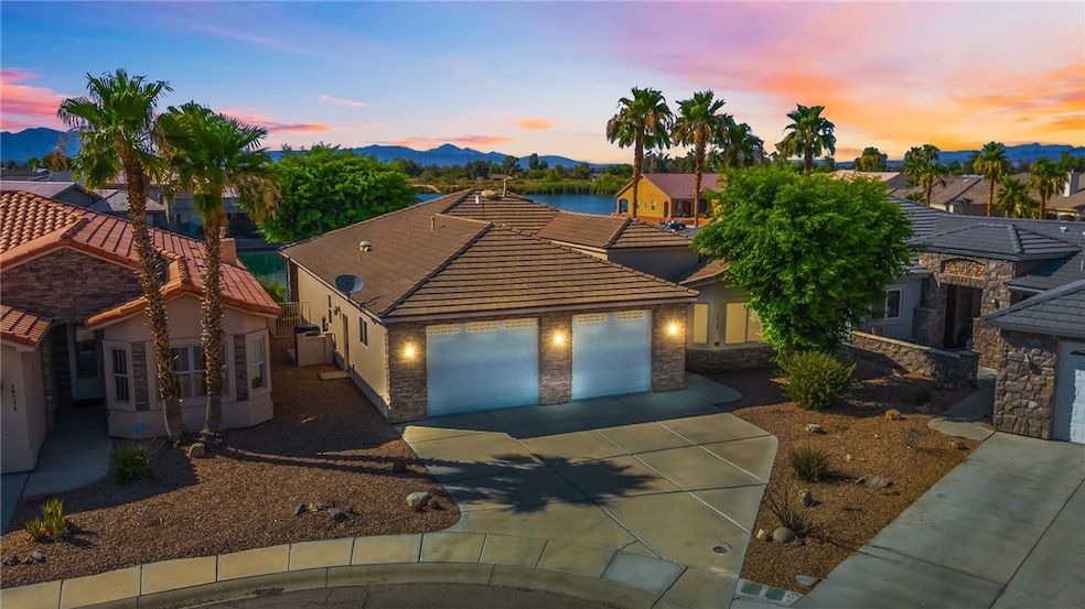 View of front facade featuring concrete driveway,