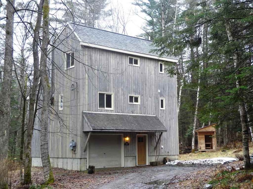 Situated on a corner lot offering a natural tree lined buffer