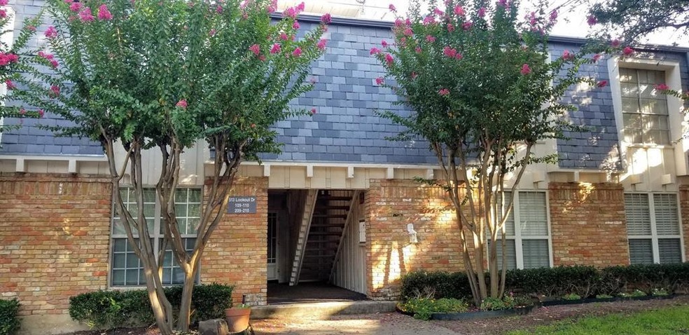Front view of the building. Unit is Upstairs